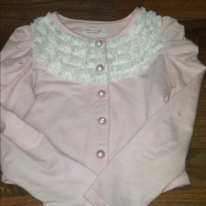 A pink ruffled jacket
